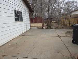 View of patio / terrace with a shed