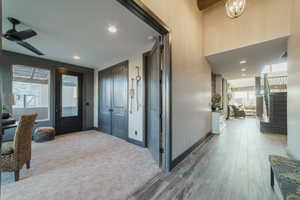 Entryway featuring wood-type flooring and ceiling fan