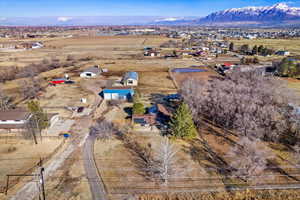 Drone / aerial view featuring a mountain view and a rural view