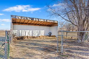 View of outdoor structure featuring a rural view