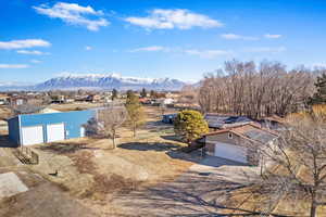 Birds eye view of property with a mountain view