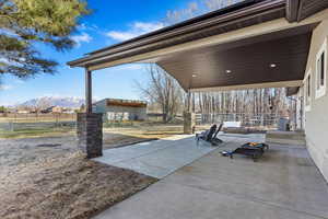 View of patio / terrace featuring cooling unit and a mountain view