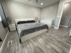 Bedroom featuring ceiling fan and light wood-type flooring