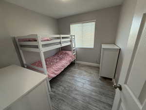 Bedroom with wood-type flooring