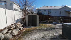 View of yard with a storage unit