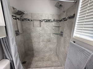 Bathroom with a shower with curtain