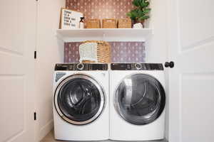 Laundry room with washing machine and clothes dryer