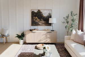 Living room with dark hardwood / wood-style flooring