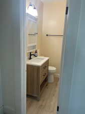 Bathroom featuring light wood-type flooring and vanity