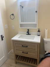 Bathroom featuring vanity and light wood-type flooring