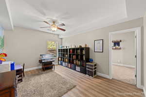 Interior space featuring hardwood / wood-style floors, a textured ceiling, and ceiling fan