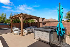 View of patio featuring a gazebo and outdoor lounge area