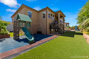 View of jungle gym featuring a yard