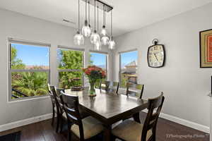 Dining area featuring dark hardwood / wood-style flooring