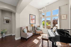 Sitting room with dark hardwood / wood-style floors