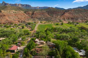 Aerial overview of property's location featuring a mountainous background