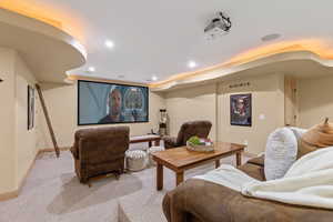 Cinema featuring recessed lighting, light colored carpet, and baseboards