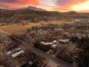 Aerial view at dusk featuring a mountain view