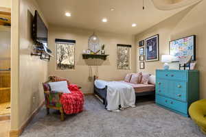 Carpeted bedroom featuring recessed lighting and baseboards