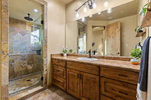 Bathroom featuring vanity and walk in shower