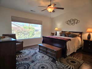 Bedroom featuring lofted ceiling, hardwood / wood-style floors, and ceiling fan