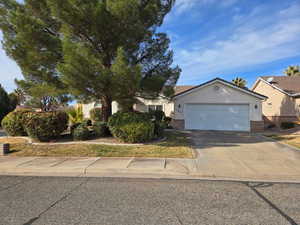 View of front of property featuring a garage