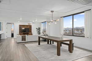 Dining room with a chandelier LVP flooring