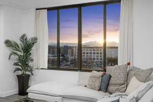 Living room with LVP flooring Oquirrh Mountain view sunset