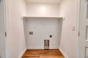 Laundry room featuring washer hookup, hookup for an electric dryer, and light hardwood / wood-style flooring