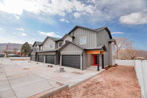 View of front facade featuring a mountain view and a garage