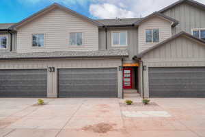 View of front facade featuring a garage