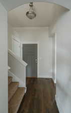 Interior space with dark hardwood / wood-style flooring