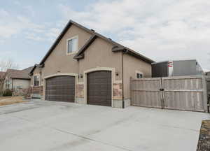 View of side of home featuring a garage