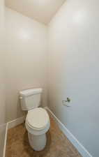 Bathroom with tile patterned floors and toilet