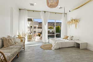 Bedroom with access to exterior and a textured ceiling