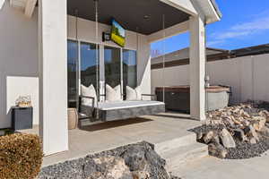 View of patio featuring a hot tub