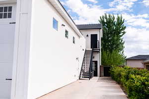 Doorway to property featuring a patio area