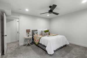 Bedroom featuring light carpet and ceiling fan