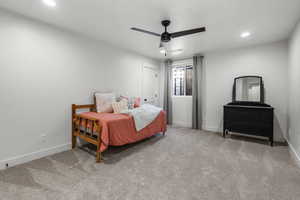 Bedroom featuring ceiling fan and light colored carpet