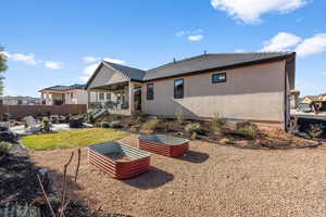 Rear view of property with a patio area