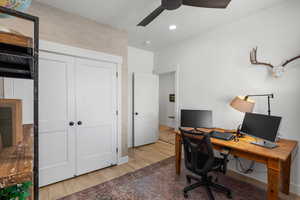 Office with ceiling fan and hardwood / wood-style floors