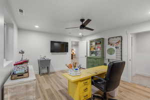 Office featuring ceiling fan and light wood-type flooring