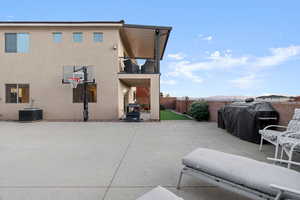 Exterior space featuring cooling unit, area for grilling, and a balcony