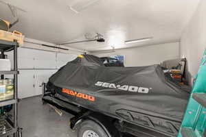 Garage featuring a garage door opener