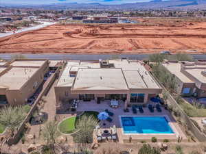 Birds eye view of property with a mountain view