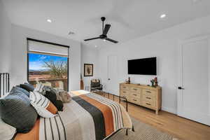 Bedroom featuring ceiling fan and light wood-type flooring