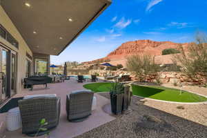 View of patio / terrace featuring a mountain view, outdoor lounge area, and a fenced in pool