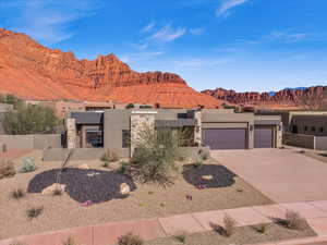 View of front of house featuring a garage and a mountain view