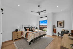 Bedroom featuring ceiling fan and light wood-type flooring