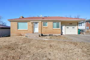 Single story home featuring a garage